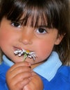 Little Girl and a Daisy Royalty Free Stock Photo