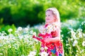 Little Girl In Daisy Flower Field