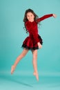 Little girl dancer jump on blue background Royalty Free Stock Photo