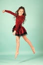 Little girl dancer jump on blue background Royalty Free Stock Photo