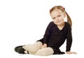 Little Girl dancer sits on White Background