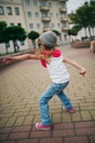 Little girl dancing on the street Royalty Free Stock Photo