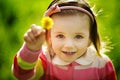 Little girl with dandelion