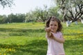 Little girl on dandelion lawn background Royalty Free Stock Photo