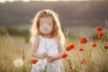 A little girl with a dandelion on a summer meadow Royalty Free Stock Photo