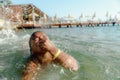 Little girl in danger drowning at the ocean