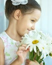 Little girl with dasies flowers