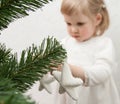 Little girl decorating Christmas tree Royalty Free Stock Photo