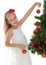 Little girl decorating Christmas tree Royalty Free Stock Photo