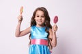 Little girl. Delicious sweetness. Multicolored lollipops