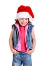 Little girl in denim suit and a hat of Santa Claus