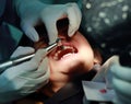 Little girl during dental extraction. Child with a teeth broken and rotten