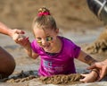 Little girl at the dirty dash going through the mud Royalty Free Stock Photo