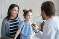 Little girl at the doctor for a checkup. Doctor auscultate the heartbeat of the child. Royalty Free Stock Photo