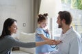 Little girl at the doctor for a checkup. The child auscultate the heartbeat of doctor for fun. Royalty Free Stock Photo