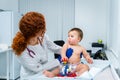 Little girl at doctor for checkup. Doctor pediatrician and baby patient. Child patient at doctor appointment Royalty Free Stock Photo