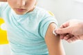 Little girl in the doctor`s office is vaccinated. Syringe with vaccine against covid-19 coronavirus,flu,dangerous infectious Royalty Free Stock Photo