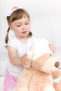 Little girl doctor with teddy bear