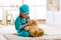 Little girl doctor with teddy bear Royalty Free Stock Photo