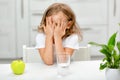 The little girl does not want or refuses to drink water Royalty Free Stock Photo