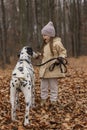 little girl with a dog in the forest Royalty Free Stock Photo