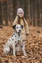 little girl with a dog in the forest Royalty Free Stock Photo