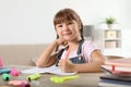 Little girl doing assignment at home Royalty Free Stock Photo