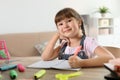 Little girl doing assignment at home Royalty Free Stock Photo