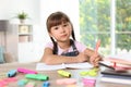 Little girl doing assignment at home Royalty Free Stock Photo