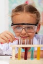 Little girl doing basic chemistry experiments Royalty Free Stock Photo