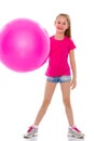 Little girl doing exercises on a big ball for fitness. Royalty Free Stock Photo