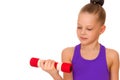 Little girl doing exercises with dumbbells. Royalty Free Stock Photo