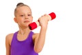 Little girl doing exercises with dumbbells. Royalty Free Stock Photo