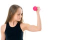 Little girl doing exercises with dumbbells. Royalty Free Stock Photo