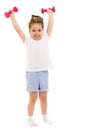 Little girl doing exercises with dumbbells. Royalty Free Stock Photo