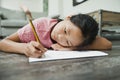 Little Girl Doing her Homework on the Floor Royalty Free Stock Photo