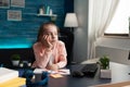 Little girl doing homework feeling bored and sad Royalty Free Stock Photo