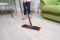 Little girl doing wet cleaning of the floor at home Royalty Free Stock Photo