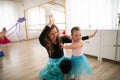 Little girl with down syndrome learning ballet with dance lecteur in ballet studio. Royalty Free Stock Photo