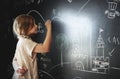 Little girl drawing on a blackboard Royalty Free Stock Photo