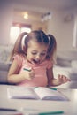 Little girl drawing and expressive positive emotion. Royalty Free Stock Photo