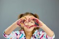 Little girl, drawing at home and make heart from hands Royalty Free Stock Photo