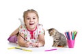 Little girl drawing with pencils and playing with cat Royalty Free Stock Photo