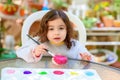 Little Girl Drawing On Stone Outdoors In Summer Sunny Day. Royalty Free Stock Photo