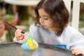 Little Girl Drawing On Stone Outdoors In Summer Sunny Day. Royalty Free Stock Photo