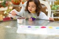 Little Girl Drawing On Stone Outdoors In Summer Sunny Day.