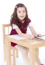 Little girl is drawing using color pencils Royalty Free Stock Photo