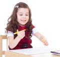 Little girl is drawing using color pencils Royalty Free Stock Photo