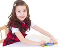 Little girl is drawing using color pencils Royalty Free Stock Photo