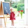 Little girl drawing on whiteboard Royalty Free Stock Photo